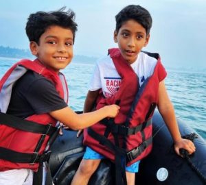 Family speed boat ride on Aravi beach with kids enjoying water sports